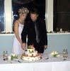 Andrea and Ryan cut the cake
